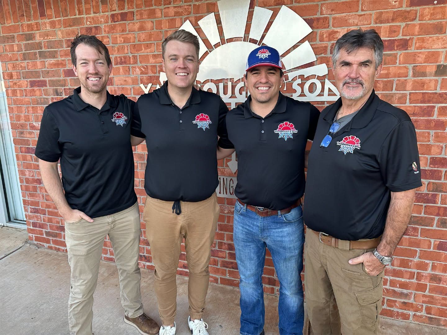 Tucker, Will and Kolby Yarbrough with their father Darren outside the Yarbrough and Sons office